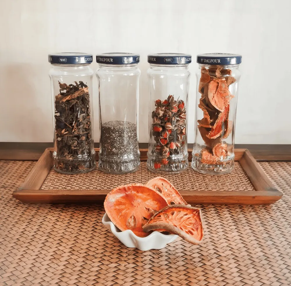 Jars of dried Thai herbs