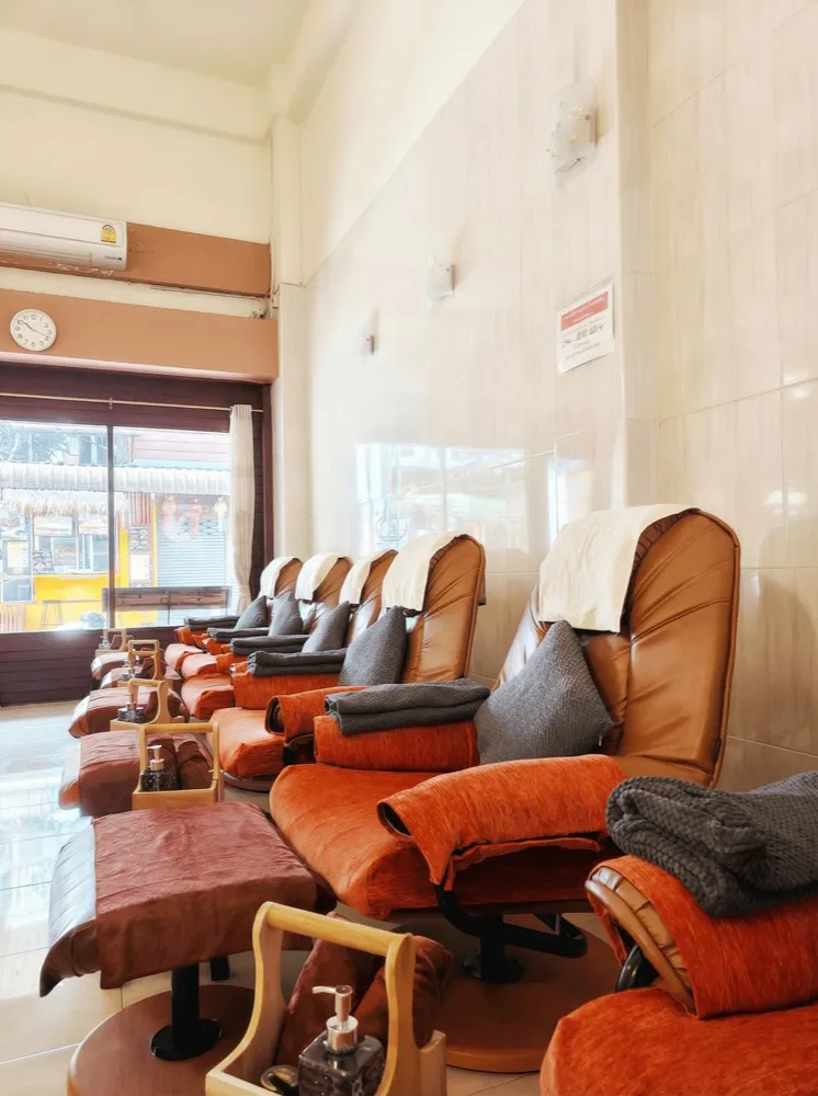 Row of foot-massage recliners
